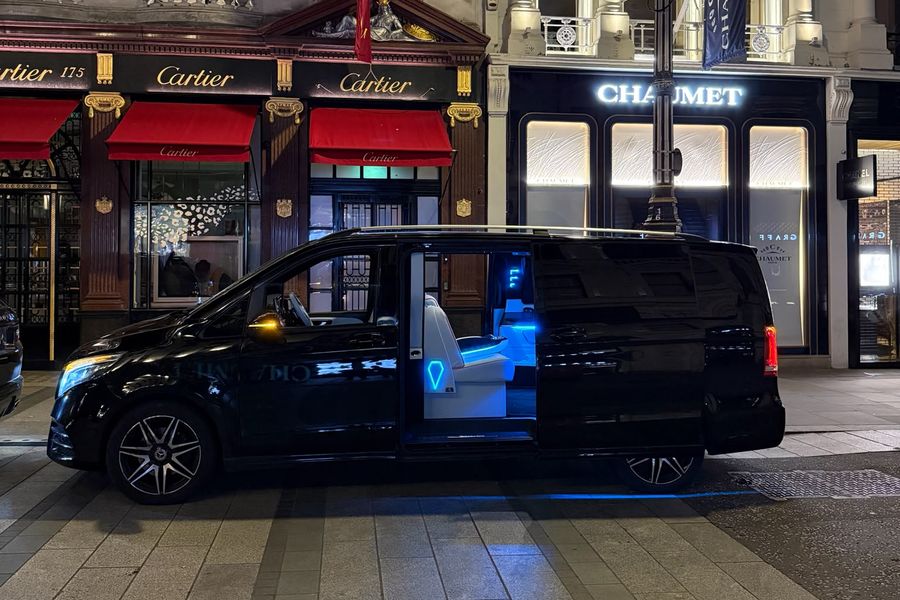 Heylux Mercedes V-Class with lit cabin parked on Bond Street, London, at night