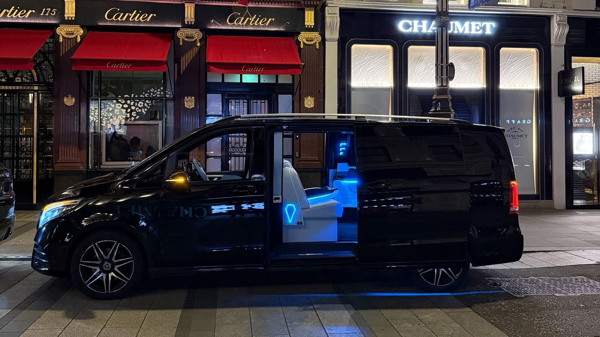 Heylux Mercedes V-Class with lit cabin parked on Bond Street, London, at night
