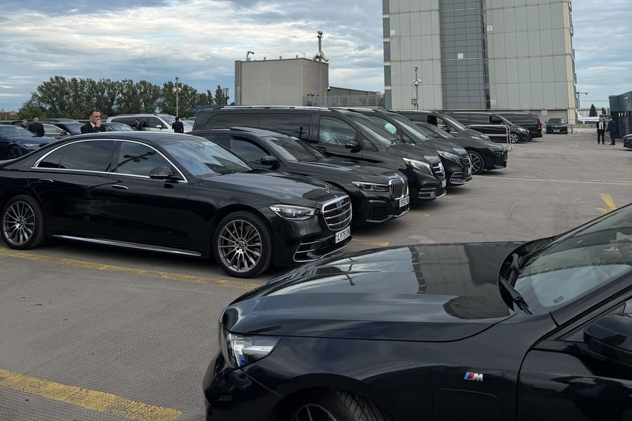 Heylux chauffeur fleet of black Mercedes waiting at a London airport car park