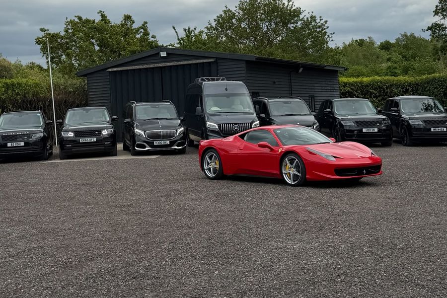 Heylux luxury fleet of Range Rovers, Mercedes vans and a Ferrari at the company depot