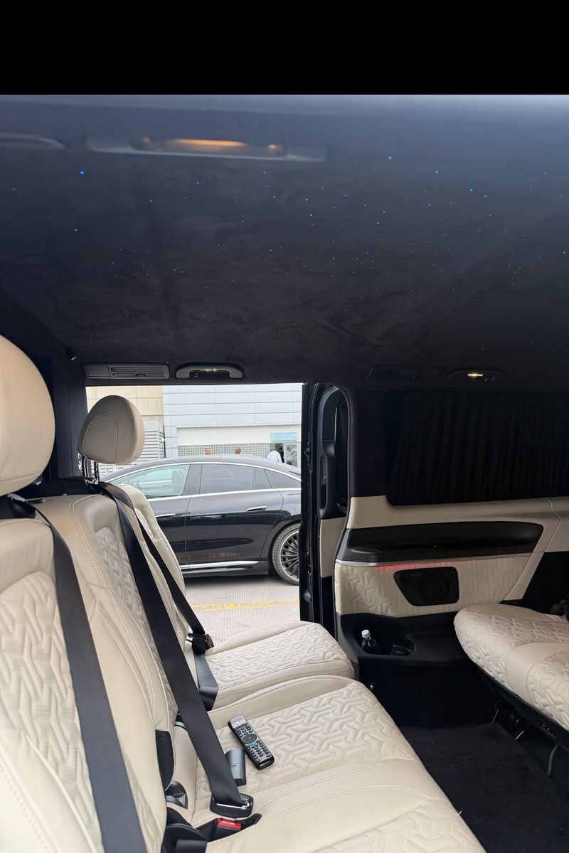Quilted cream leather rear cabin and starlight headlining inside a Heylux Mercedes V-Class chauffeur vehicle