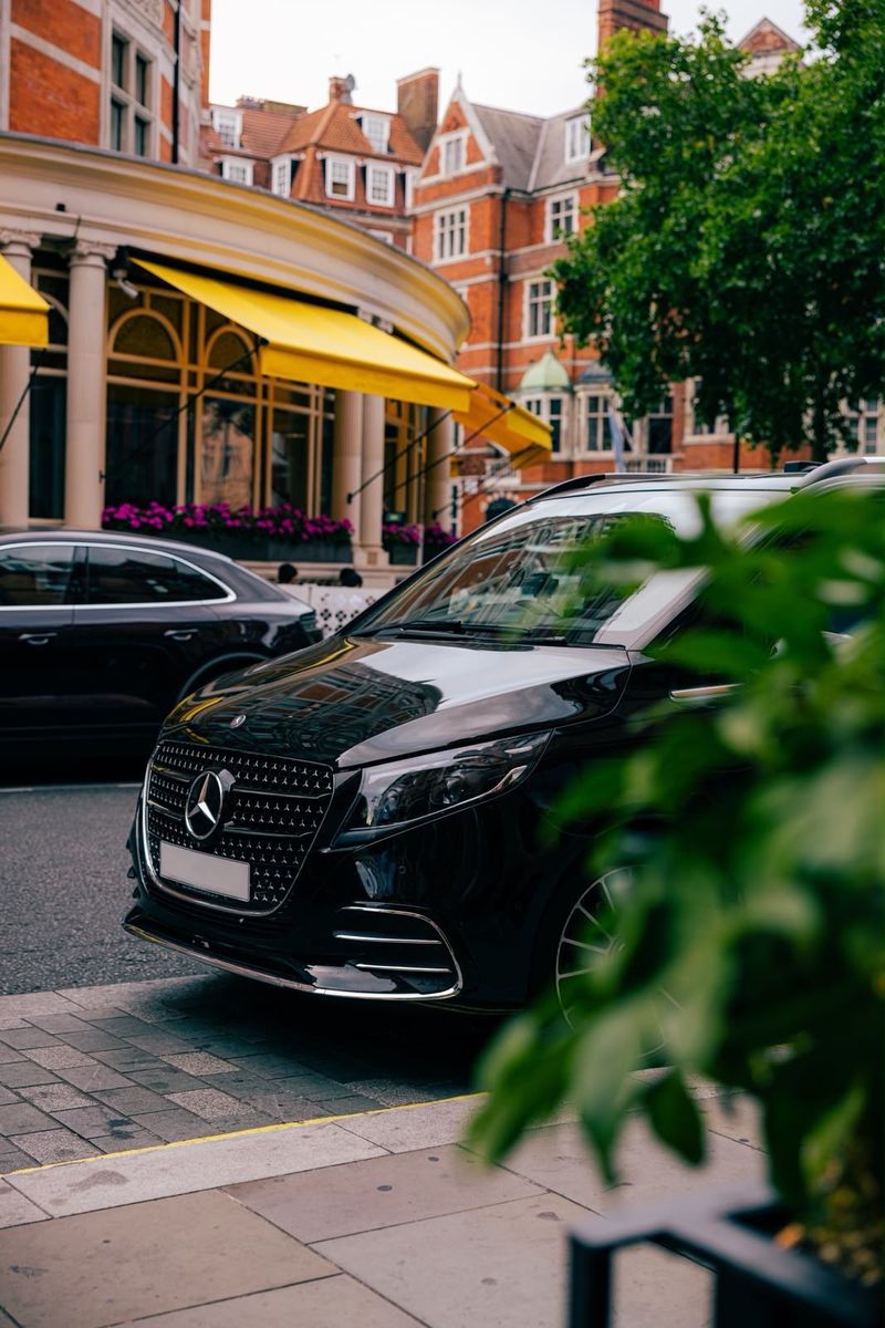 Mercedes V-Class chauffeur vehicle outside a Mayfair hotel, London
