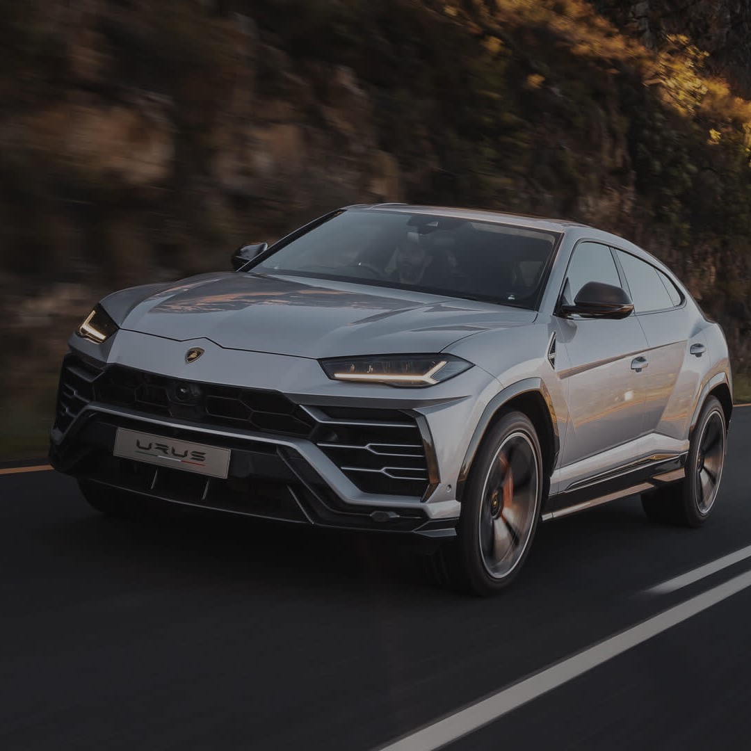 Lamborghini Urus chauffeur hire London side profile