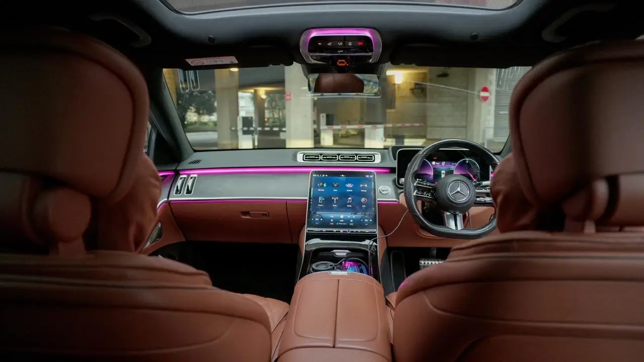 Mercedes S-Class front cabin, cognac leather with pink ambient lighting