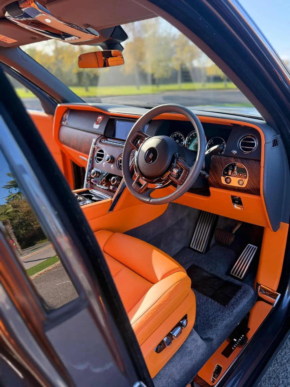 Rolls-Royce Cullinan interior with orange leather and wood trim