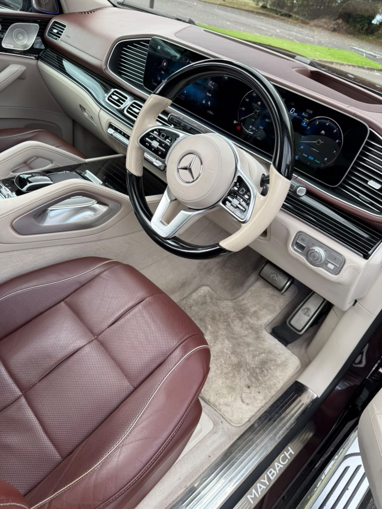 Mercedes-Maybach GLS 600 dashboard with wood and leather steering wheel and burgundy leather seats