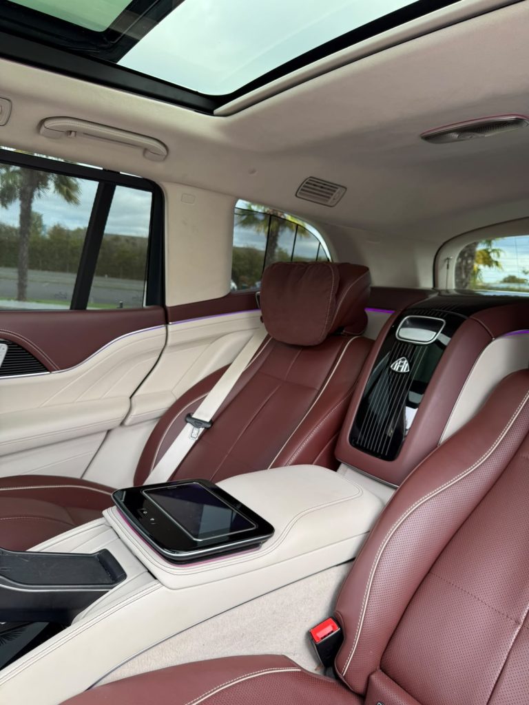 Rear cabin of the Maybach GLS with panoramic sunroof, ambient lighting and rear tablet controller