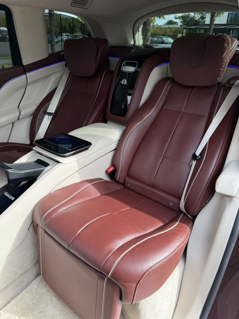Reclining rear executive seat with calf rest in burgundy Nappa leather inside the Maybach GLS 600